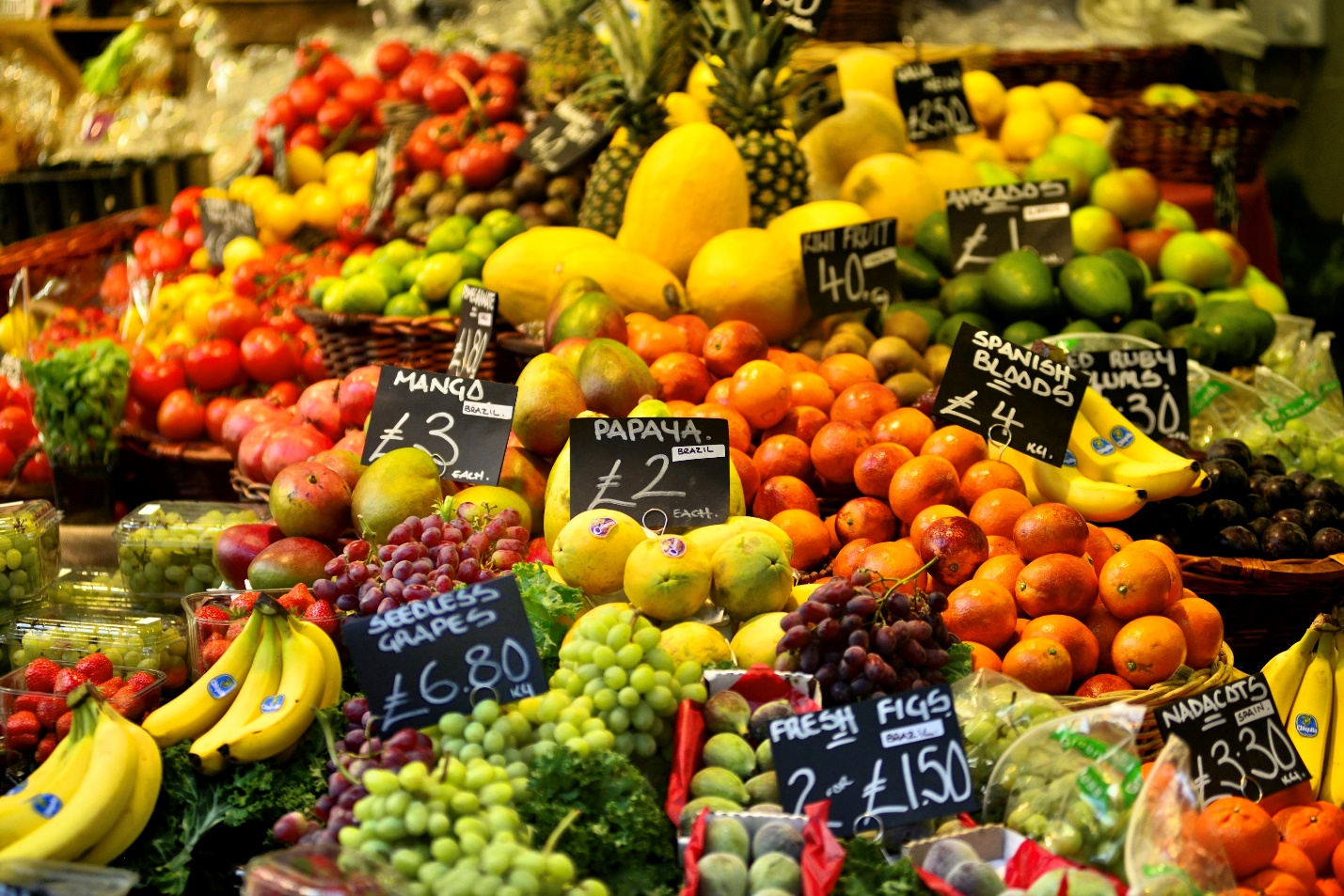 a large display of fruits and vegetables for sale